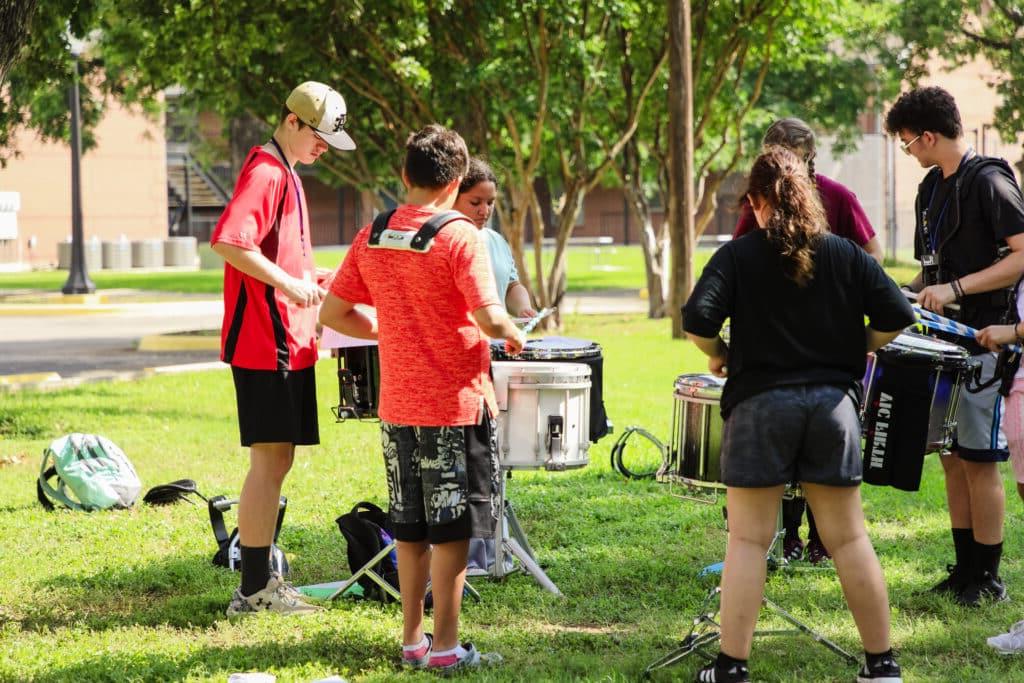 Students rehearse in a percussion breakout group.